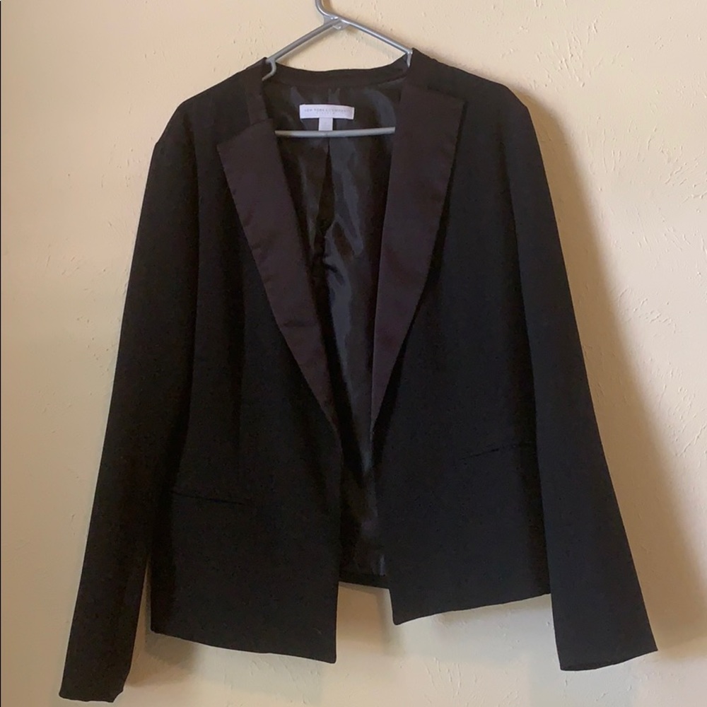 Tuxedo jacket with satin trim finish.